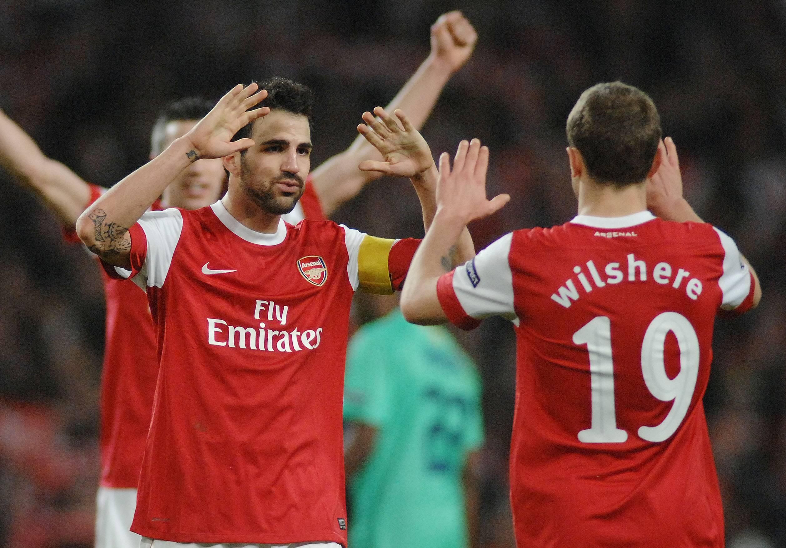 Cesc Fabregas celebrates with Jack Wilshere