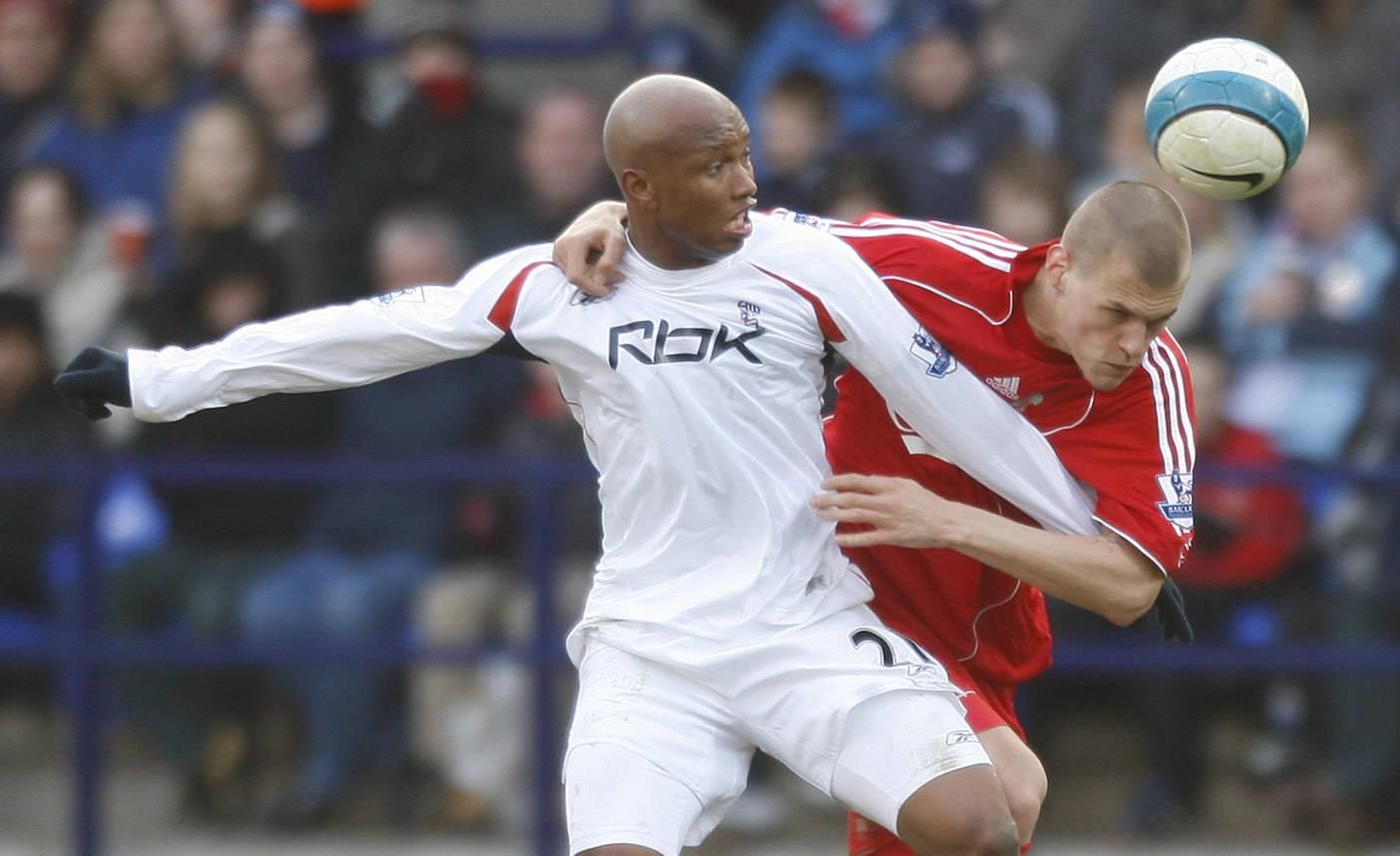Bolton Wanderers El Hadji Diouf challenges Martin Skrtel of Liverpool during the Barclays Premier League match between Bolton Wanderers and Liverpool