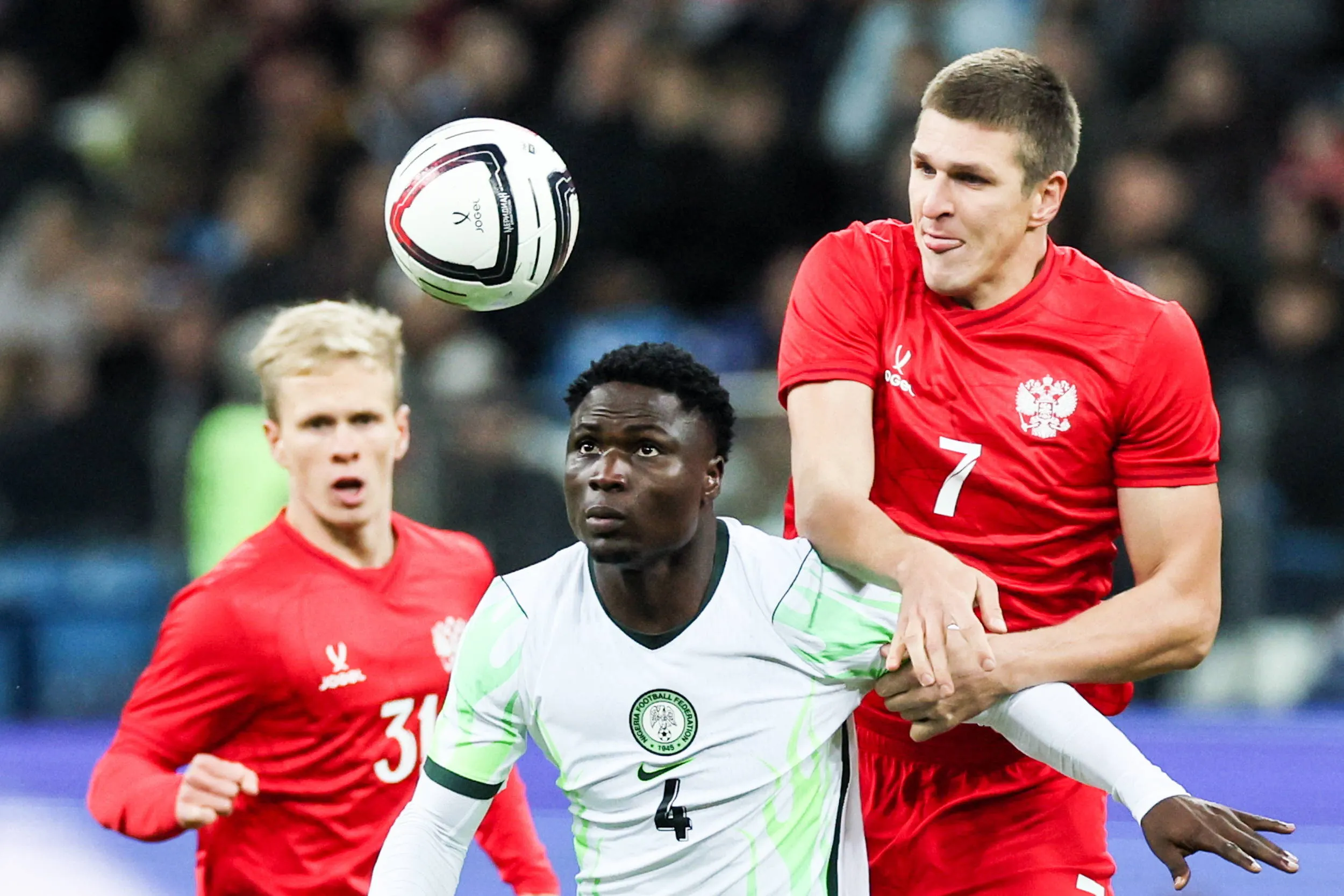 Aderemi Adeoye in the middle of Matvei Kislyak & Alexander Sobolev. 