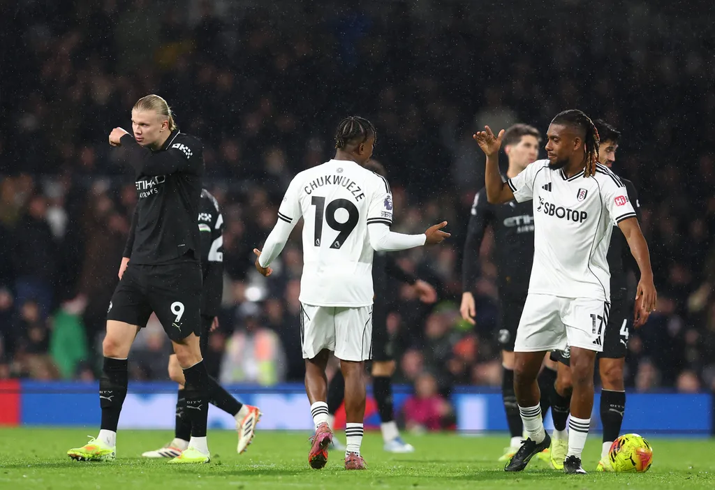 Samuel Chukwueze celebrates scoring their third goal bringing the score to 3-5 during the Fulham vs Manchester City with Alex Iwobi