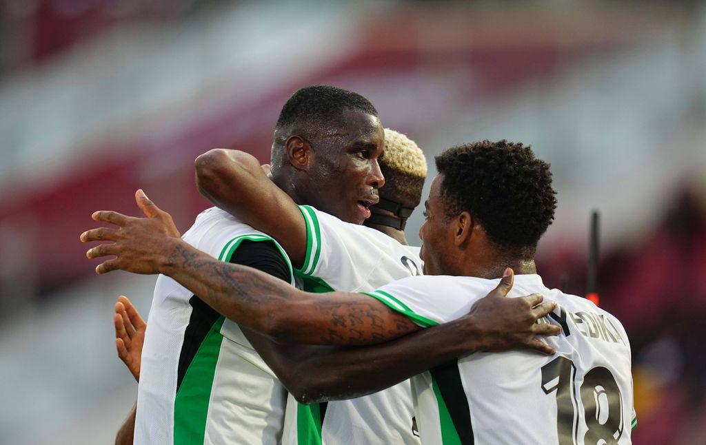 Ebere Paul Onuachu scores and celebrates his team's first goal during the Africa Cup Of Nations match between Uganda and Nigeria