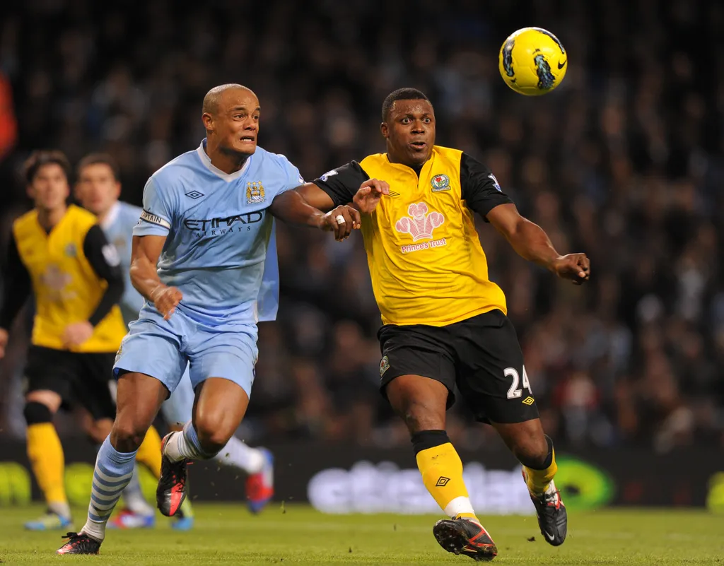 Vincent Kompany challenges Yakubu Aiyegbeni during the Barclays Premier league match between.Manchester City v Blackburn Rovers