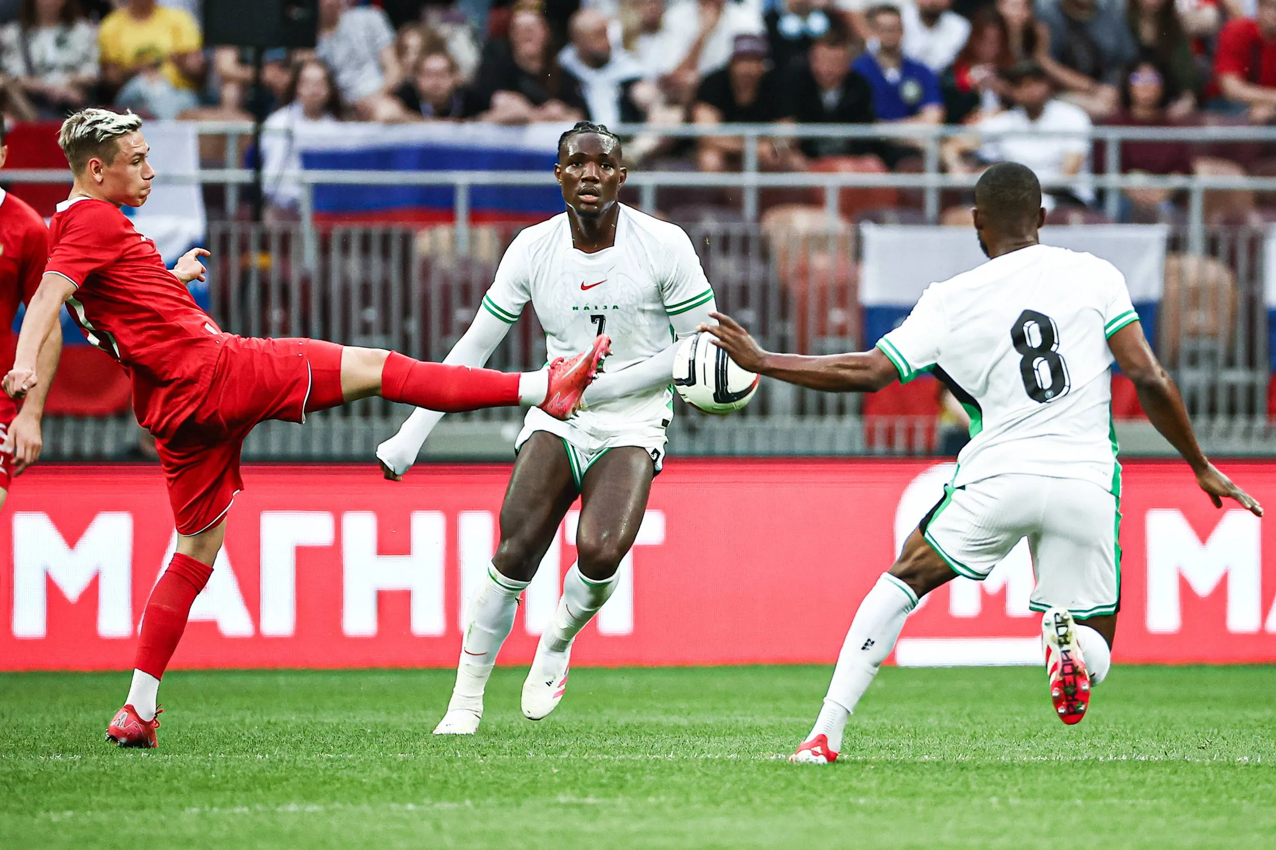 Russia's Andrei Mostovoy, Nigeria s Christantus Uche and -Ogochukwu Frank Onyeka L-R are in action in a friendly football match between Russia and Nigeria at Luzhniki Stadium.