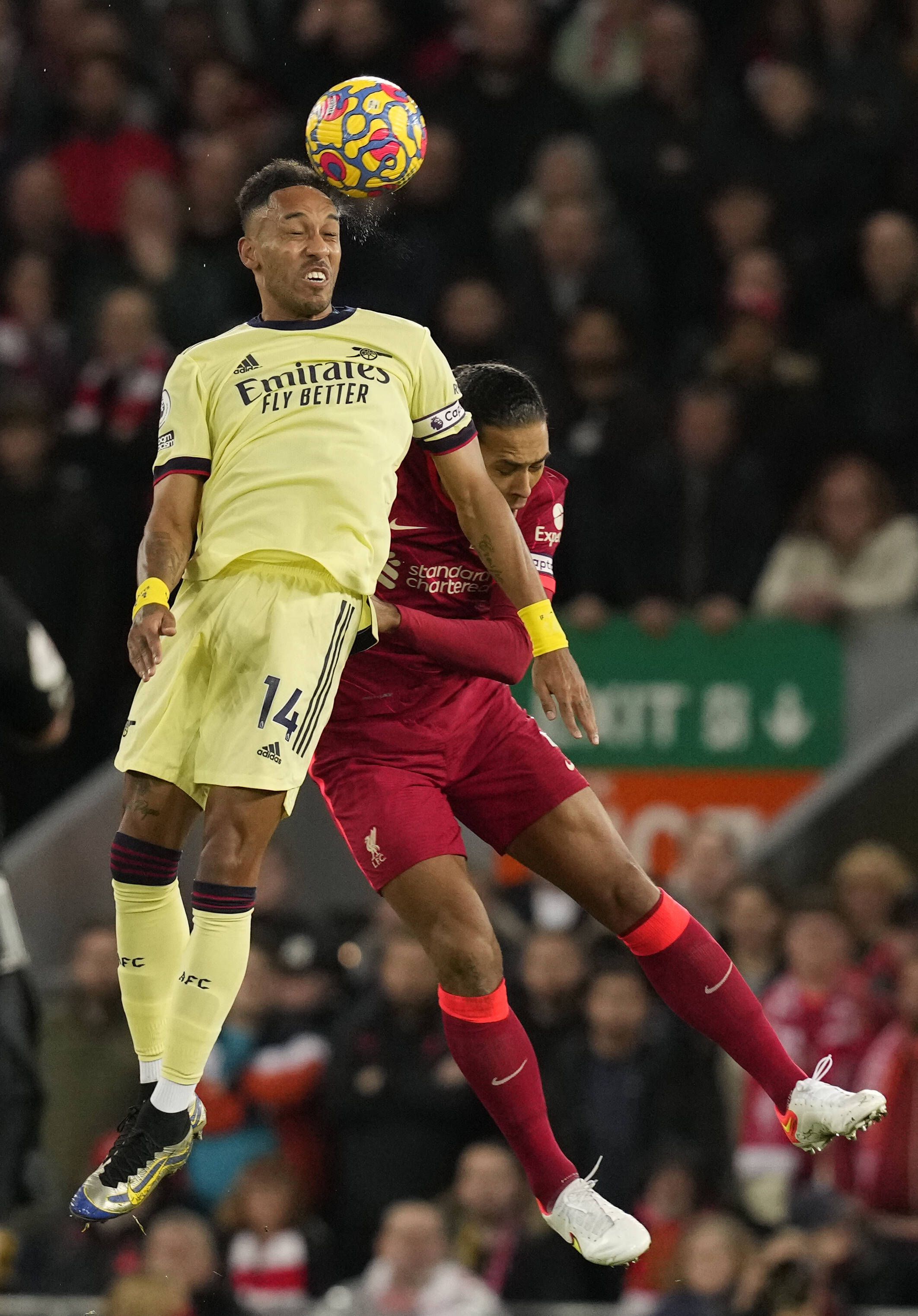 Pierre-Emerick Aubameyang rises above Virgil van Dijk of Liverpool during the Premier League match at Anfield, Liverpool