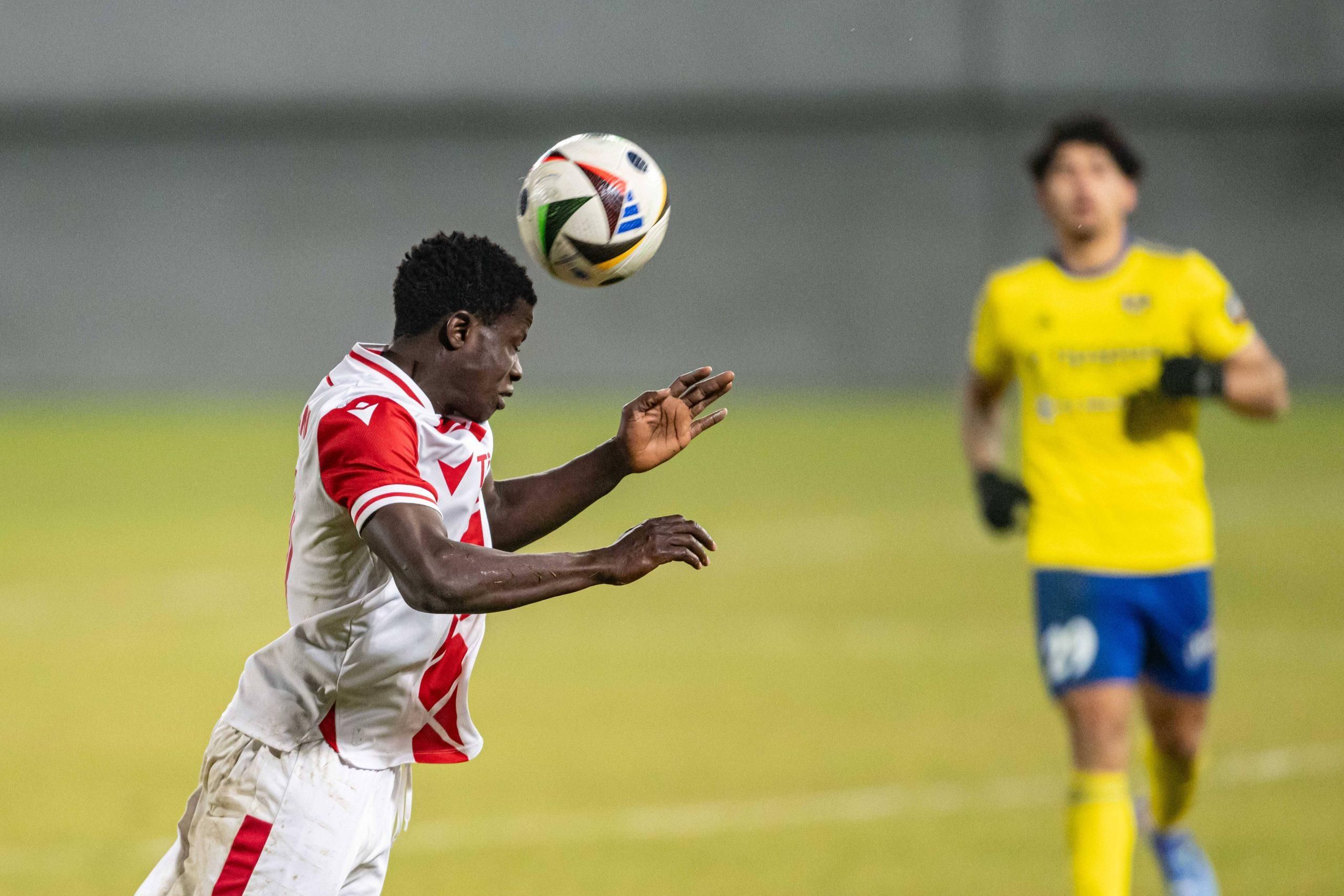 Sani Suleiman in a header battle during Nike liga match