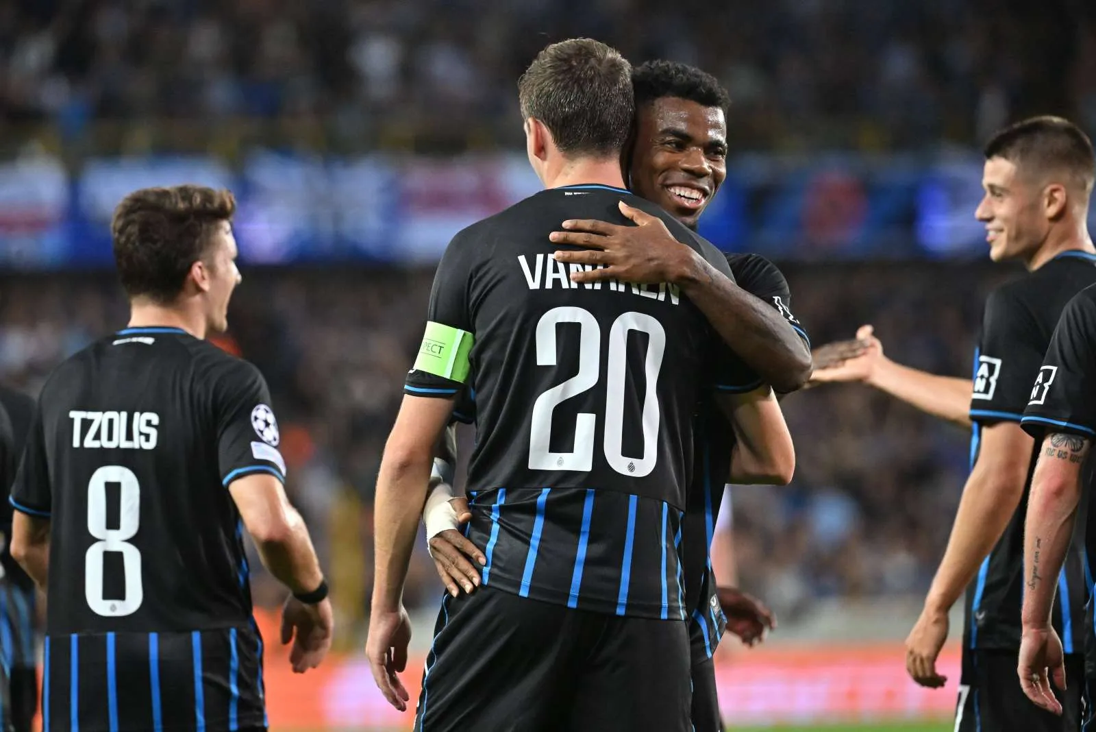 Raphael Onyedika hugs Vanaken Club Brugge