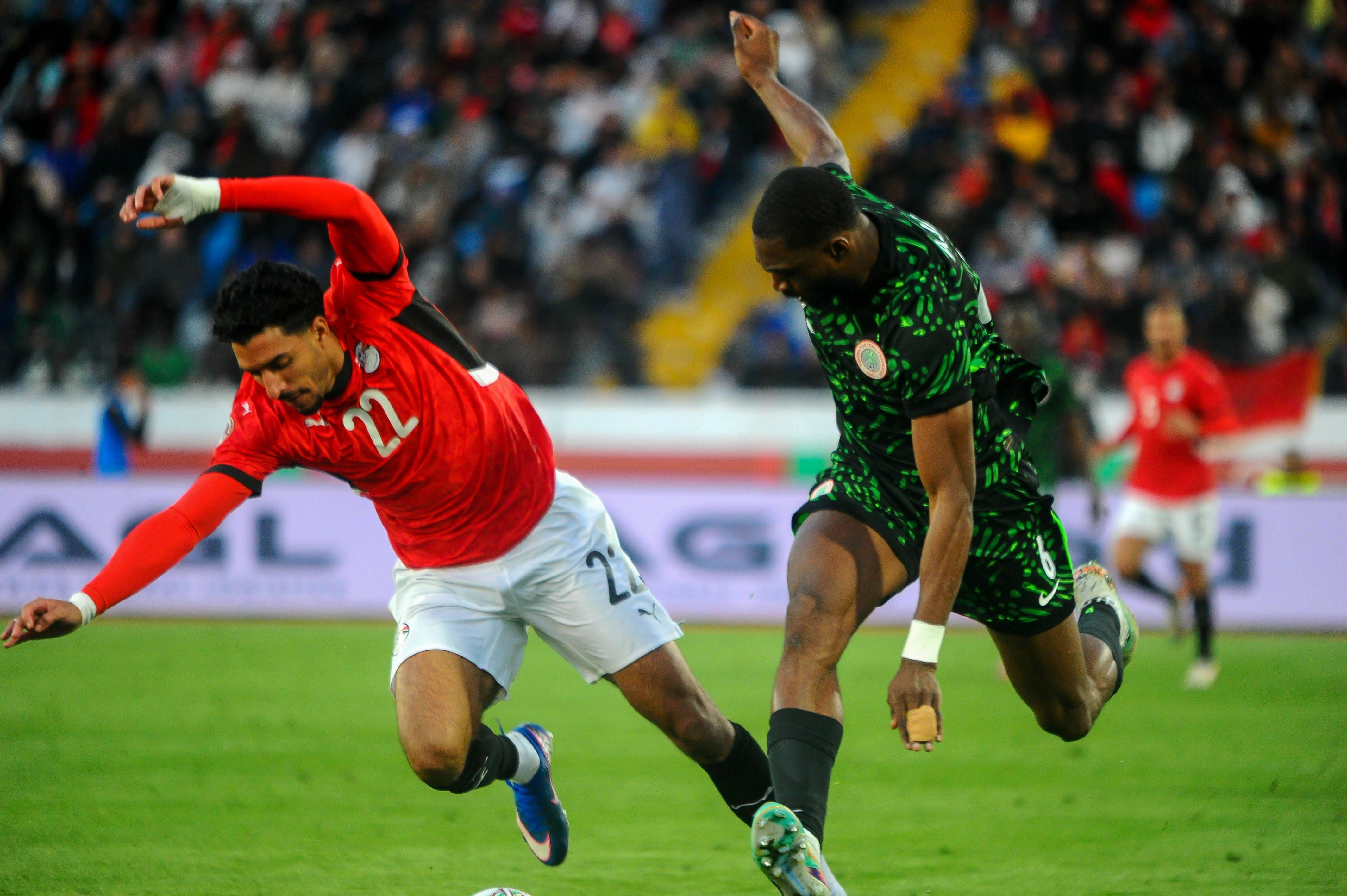 Semi Ajayi and Omar Khaled Mohamed Marmoush during the AFCON third place match between Egypt and Nigeria