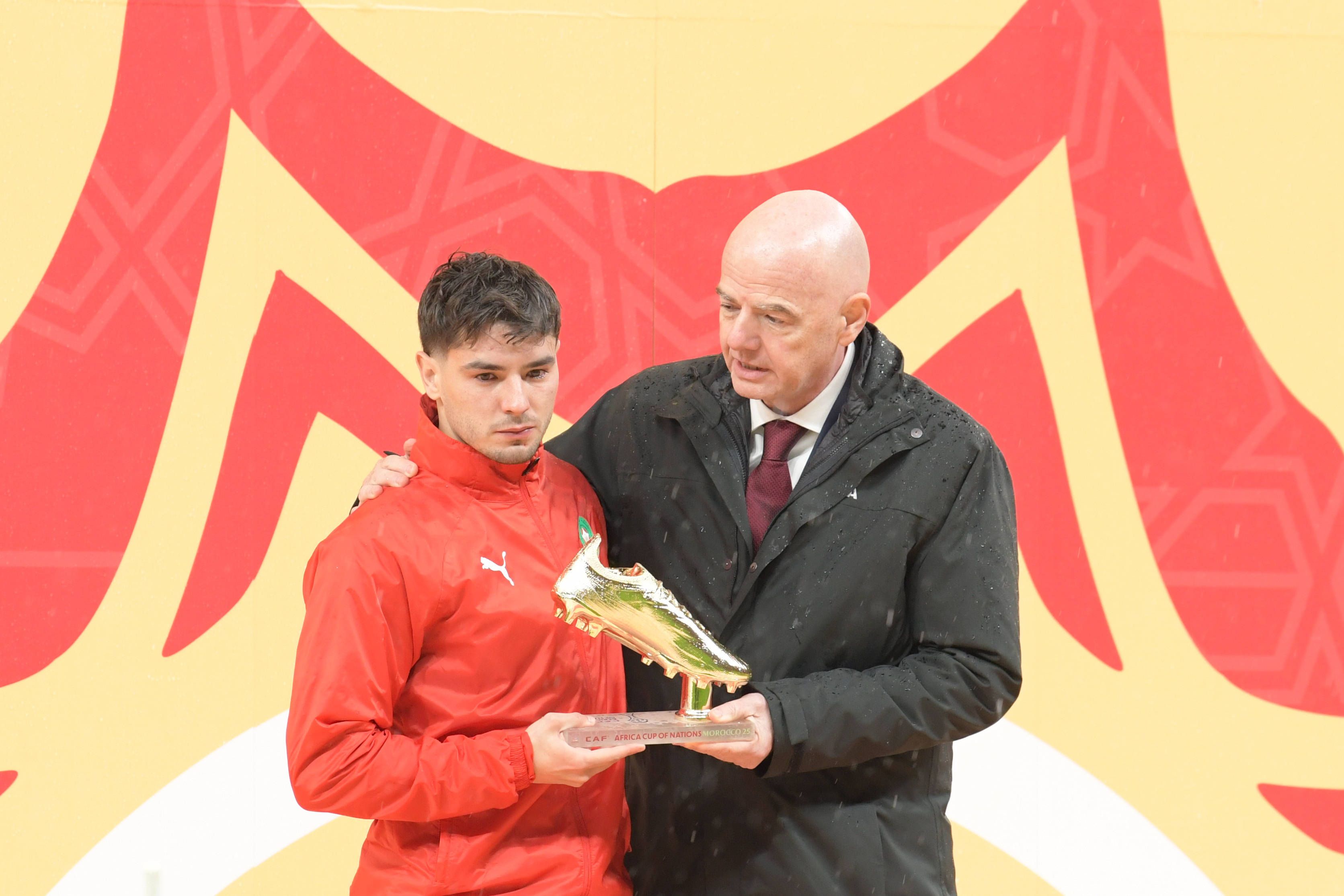 Morocco's Brahim Diaz receives the Golden Boot from FIFA President Gianni Infantino
