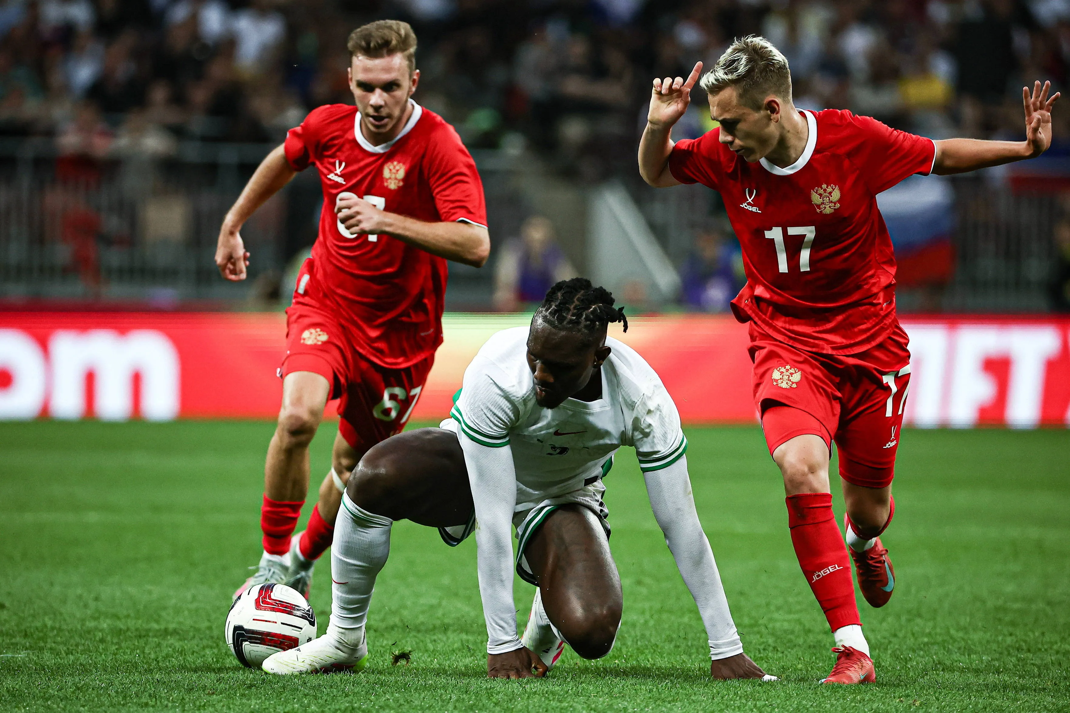 Maxim Glushenkov and Christantus Uche battle in Super Eagles vs Russia clash