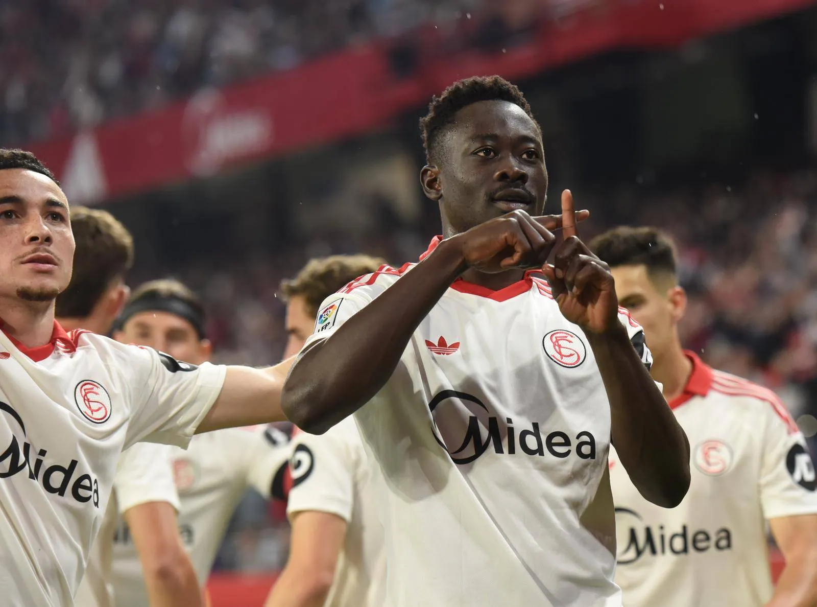 Akor Adams celebrates Sevilla's goal against Atletico Madrid