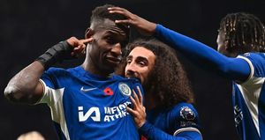 Photo: Former Wolves and Super Eagles star enjoys Chelsea vs Tottenham London derby with son