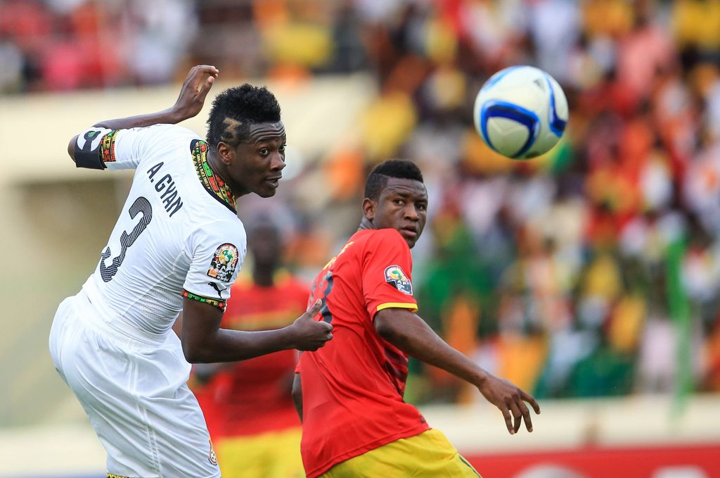Asamoah Gyan competes during a quarterfinal match of Africa Cup of Nations between Ghana and Guinea