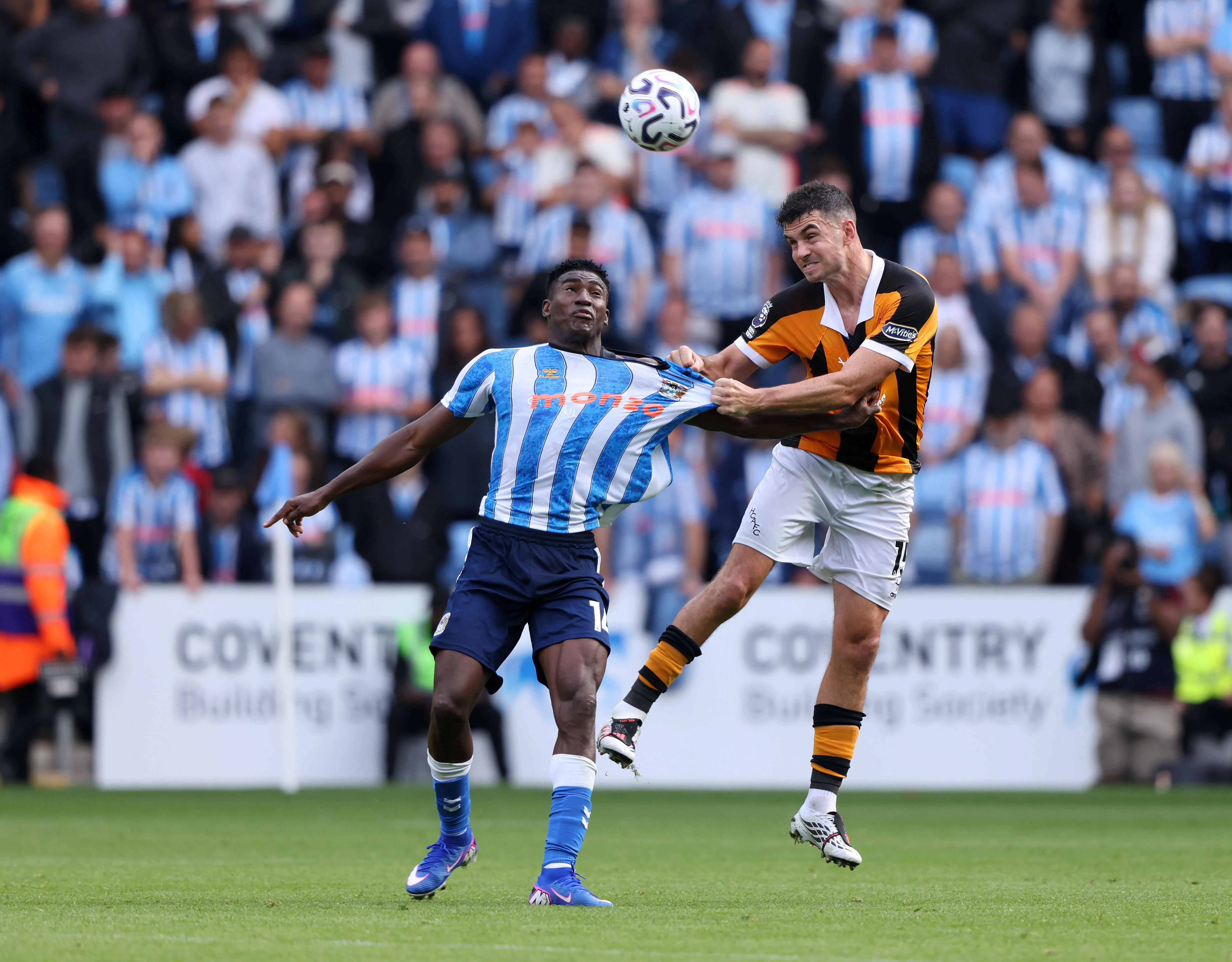 Taiwo Awoniyi battles John Egan in the Coventry City v Hull City, EPL match