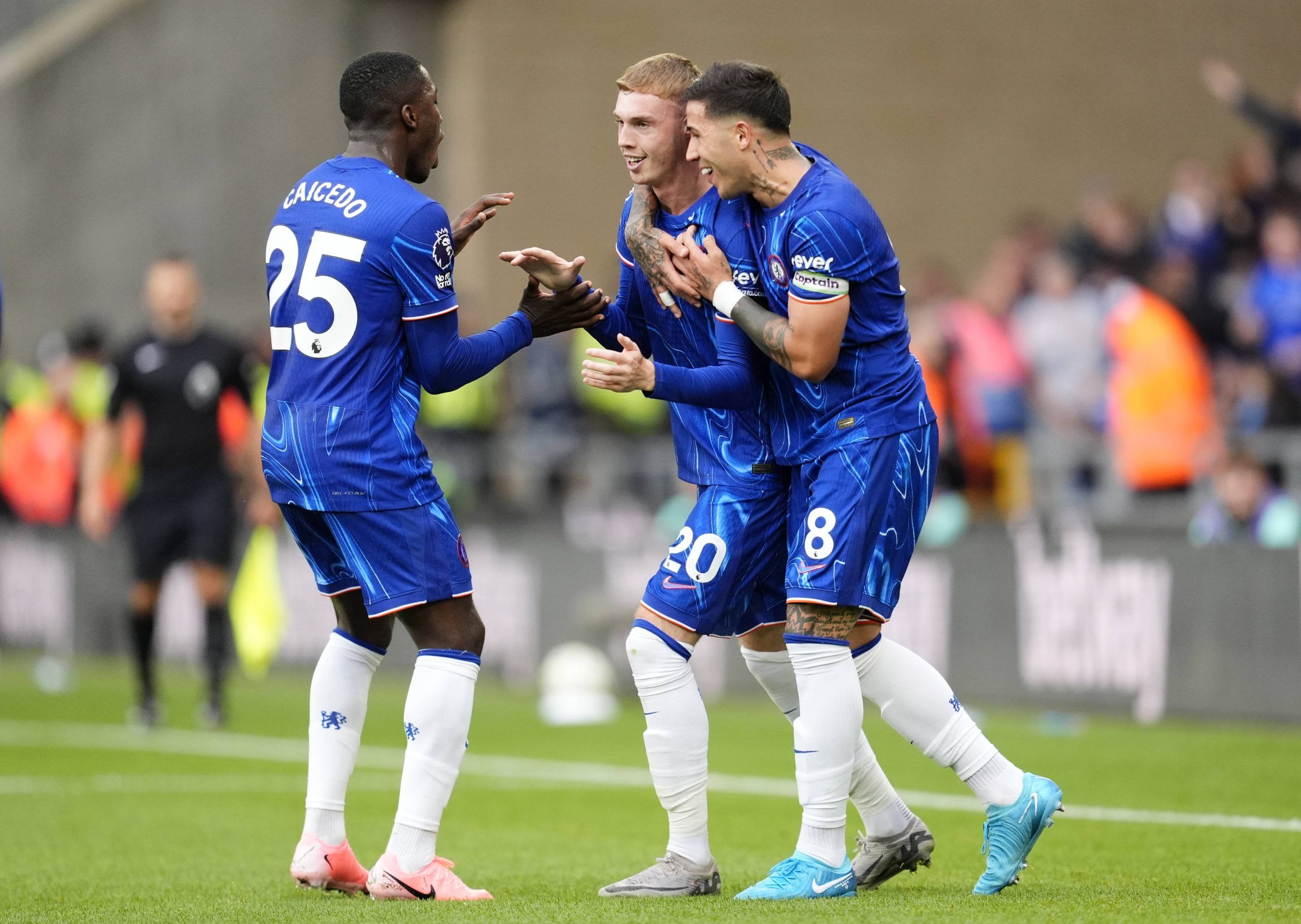 Cole Palmer celebrates scoring his sides second goal of the game with Moises Caicedo left and Enzo Fernandez during the Premier League match at Molineux Stadium, Wolverhampton