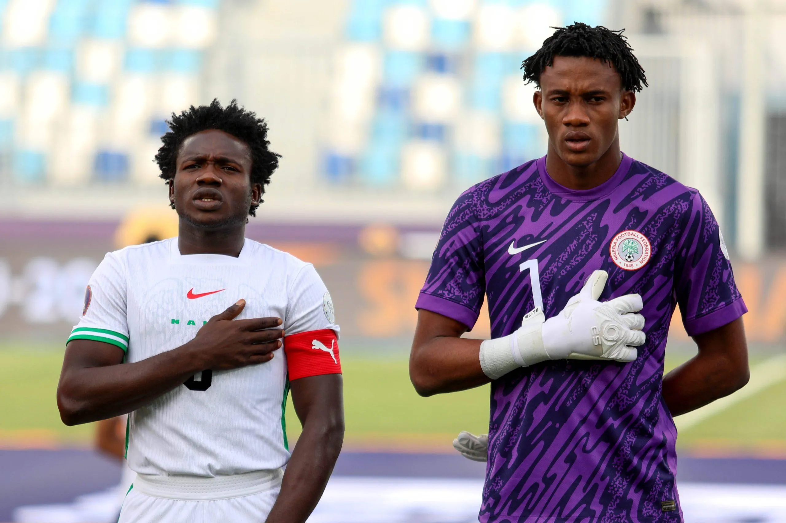 Flying Eagles captain Bameyi and goalkeeper Ebenezer Harcourt