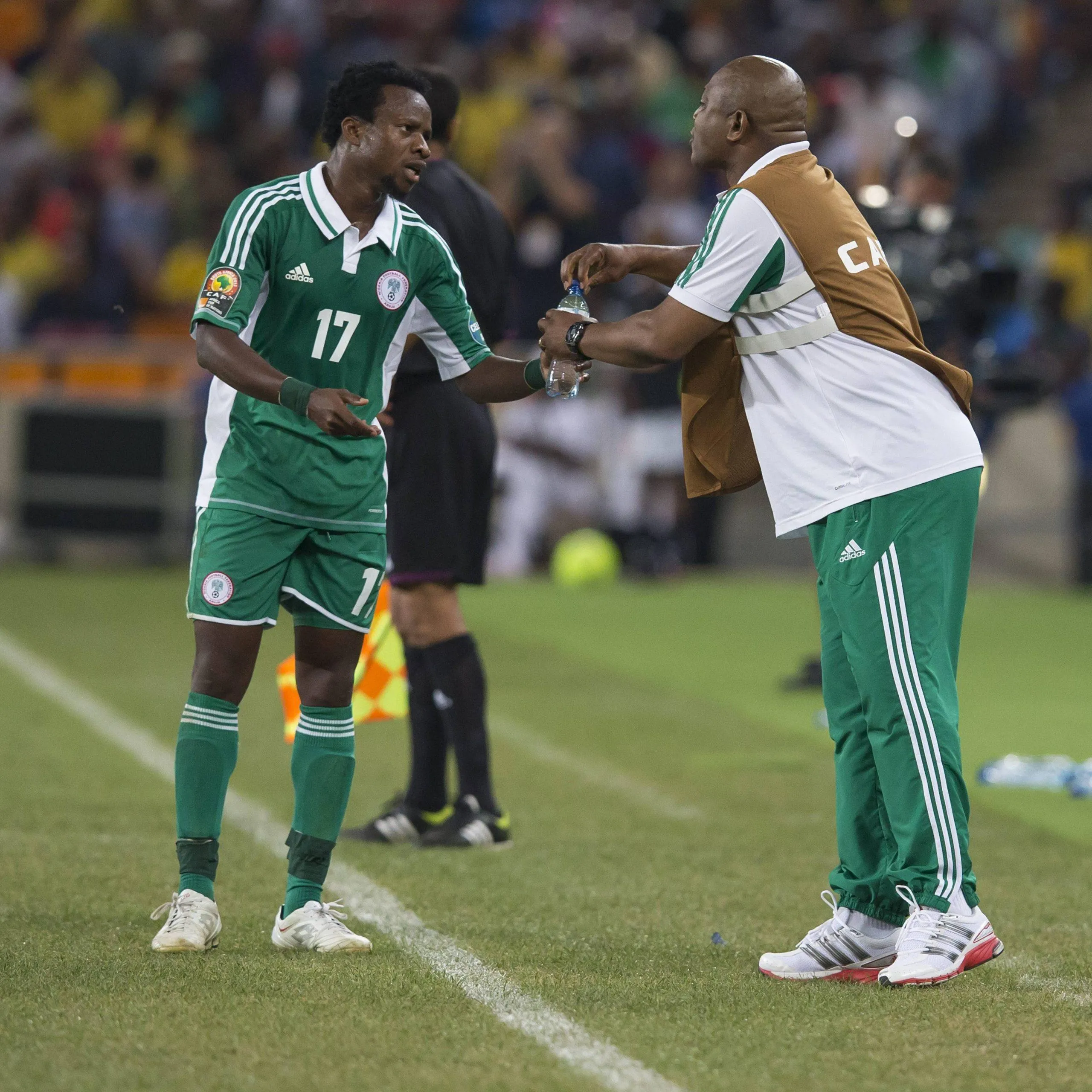 Former Lazio star Ogenyi Onazi from Nigeria and Stephen Keshi during the 2013 Orange African Cup of Nations