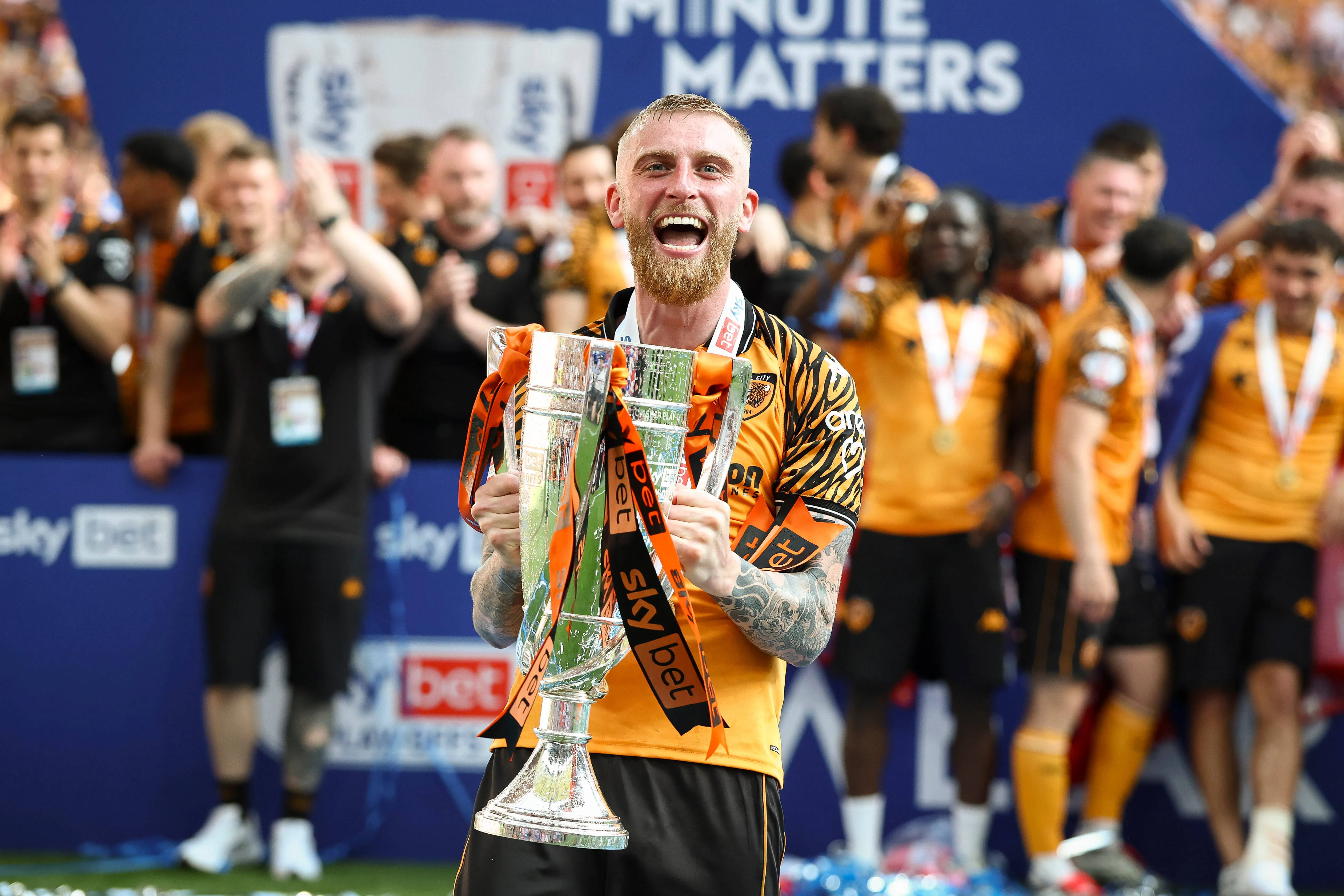 Oliver McBurnie of Hull City lifts the trophy