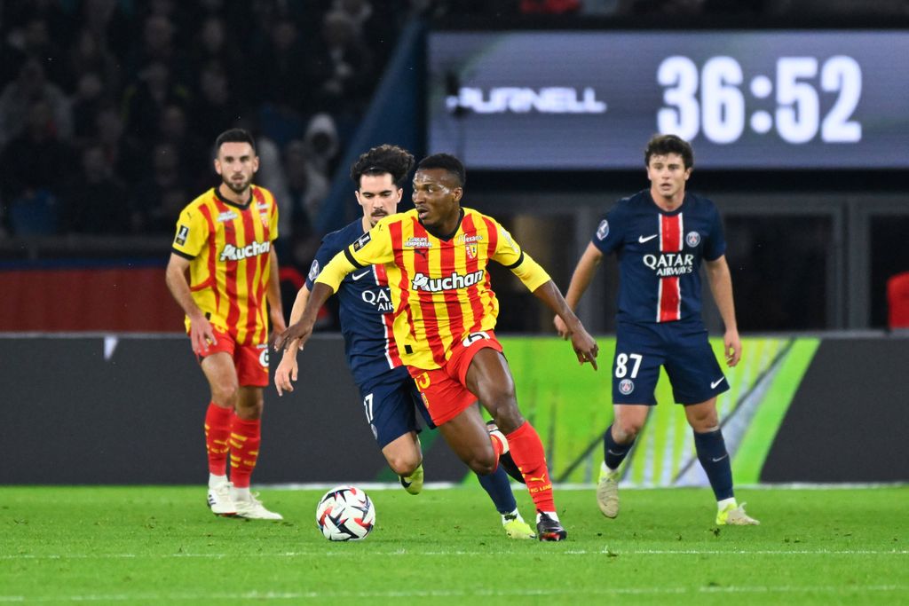 Hamzat Ojediran and Vitinha Vitor Machado during the Ligue 1 match between Paris Saint-Germain and Racing Club de Lens at Parc Des Princes
