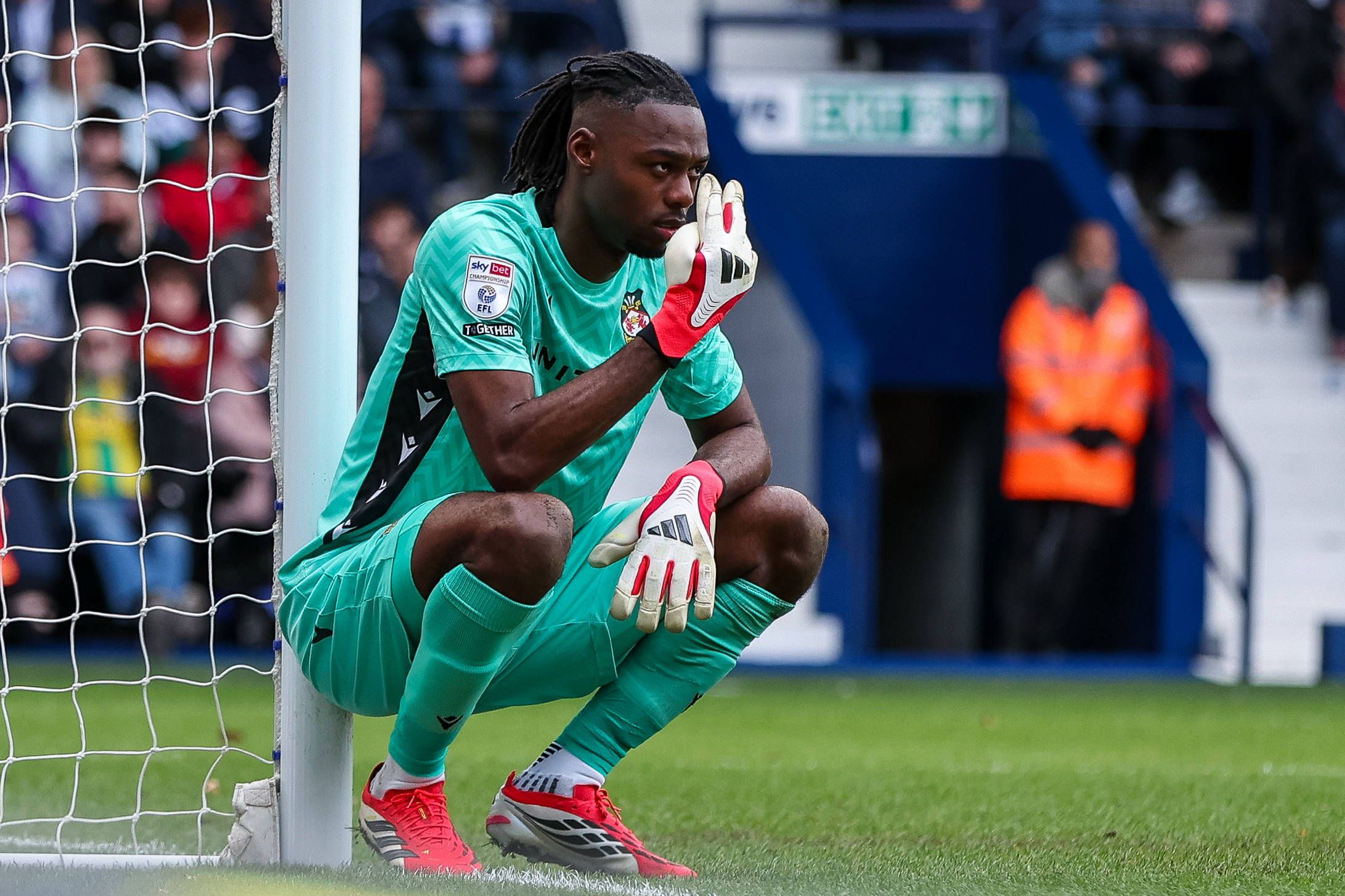 Wrexham goalkeeper Arthur Okonkwo directs his defense during the Sky Bet Championship match between West Bromwich Albion and Wrexham at The Hawthorns, West Bromwich, on April 3, 2026