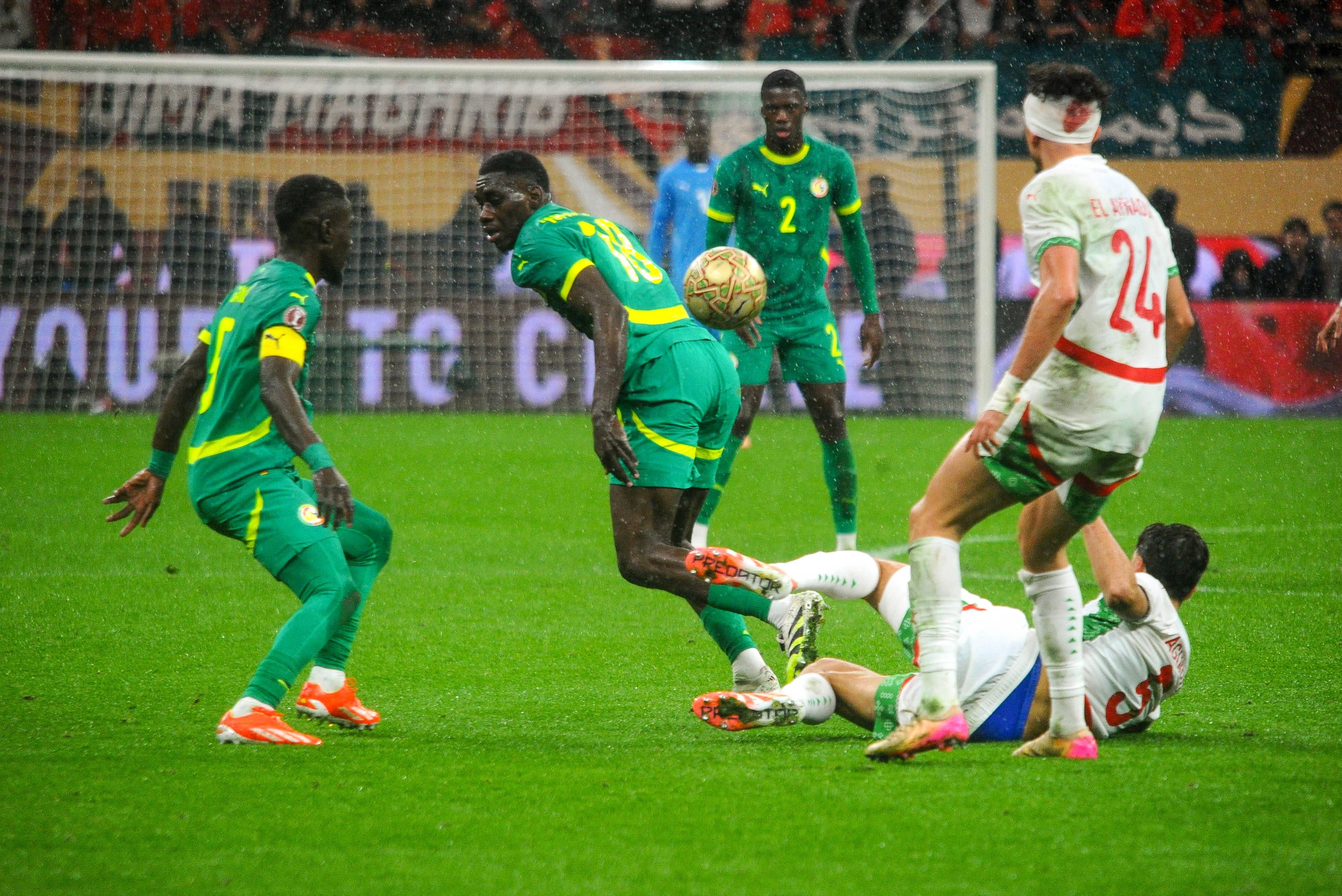 Neil El Aynaoui and Ismaila Sarr during the AFCON Final match between Senegal and Morocco