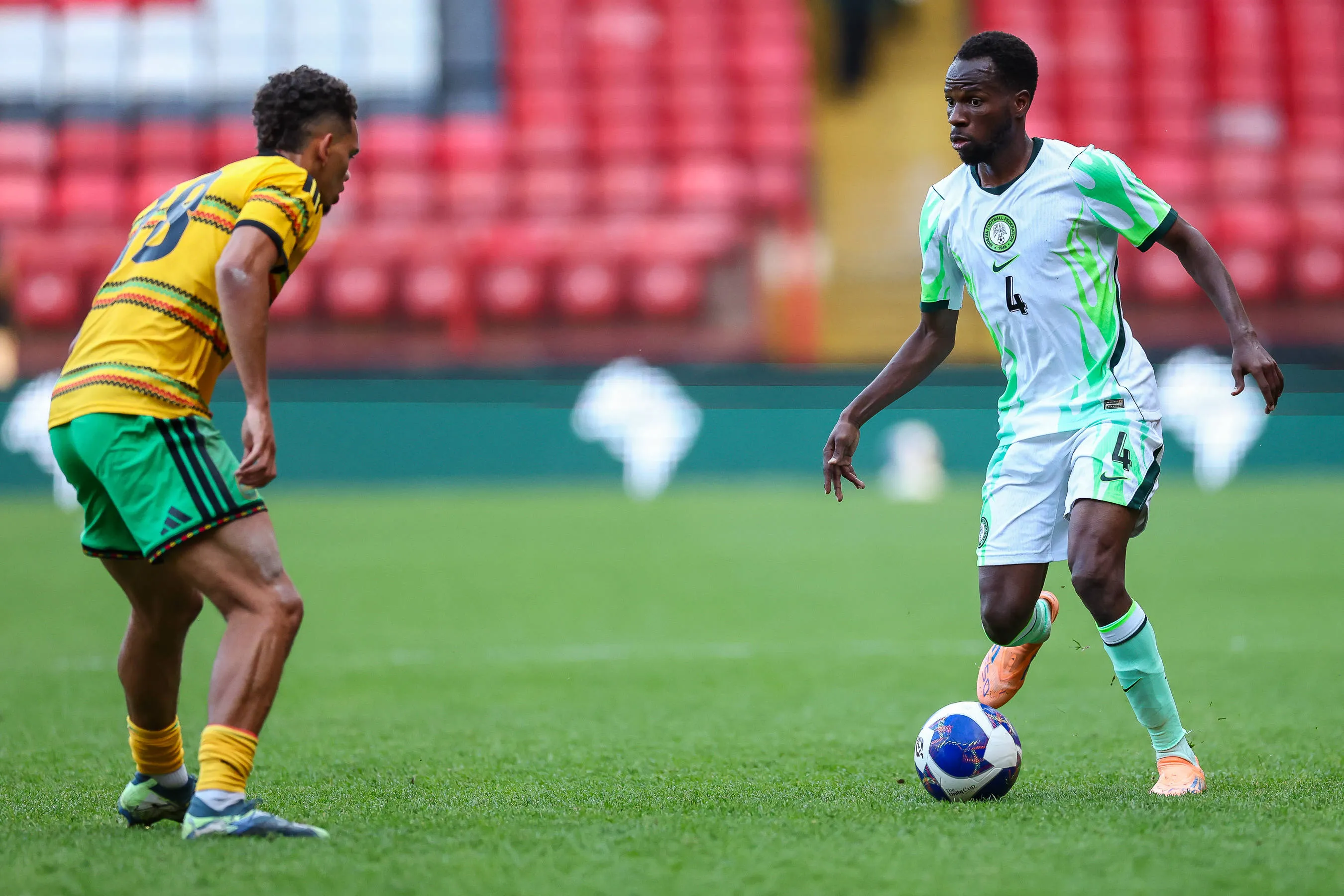 Super Eagles midfielder Alhassan Yusuf and Jamaica midfielder Brandon Cover