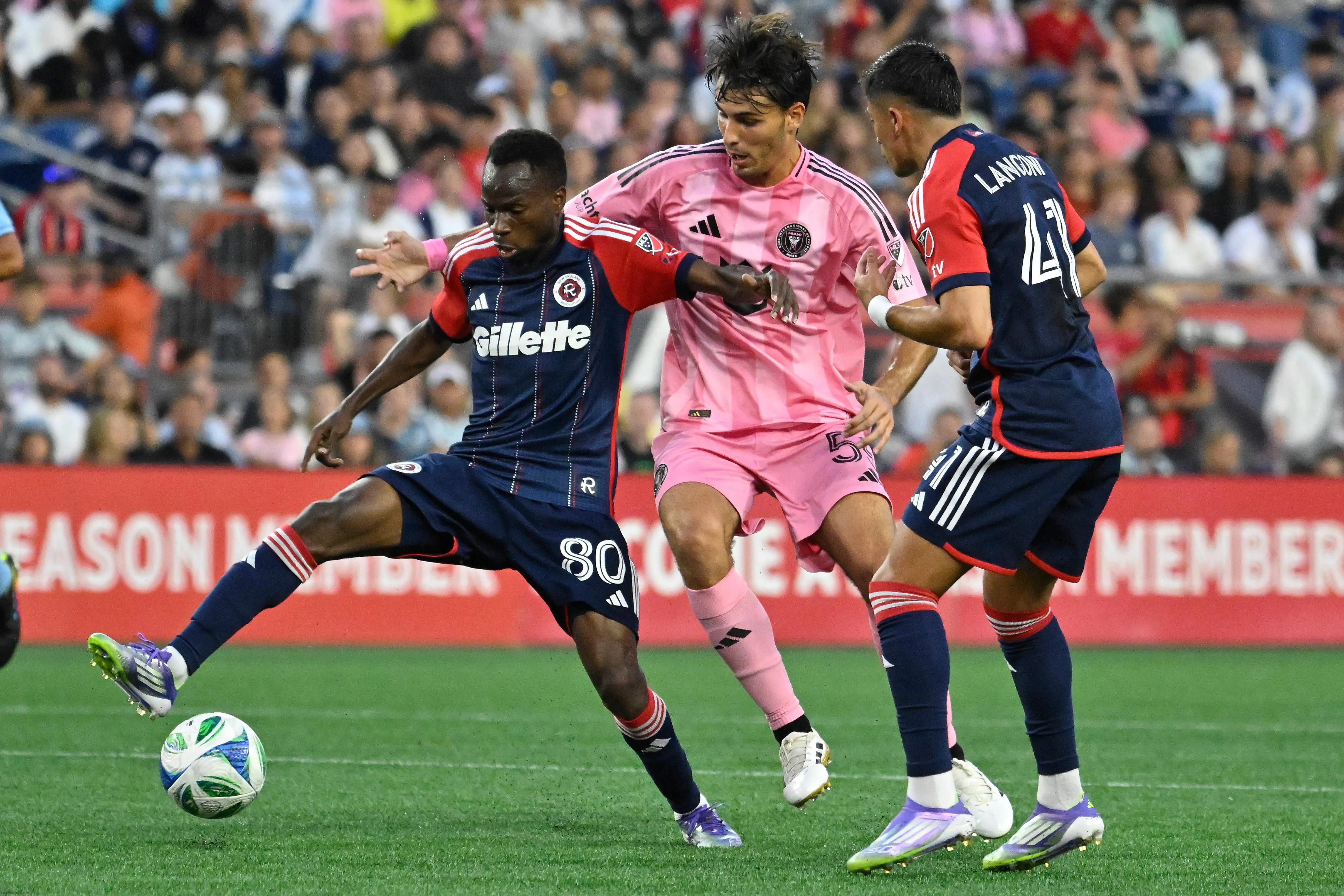 New England Revolution midfielder Alhassan Yusuf controls the ball against Inter Miami midfielder Federico Redondo
