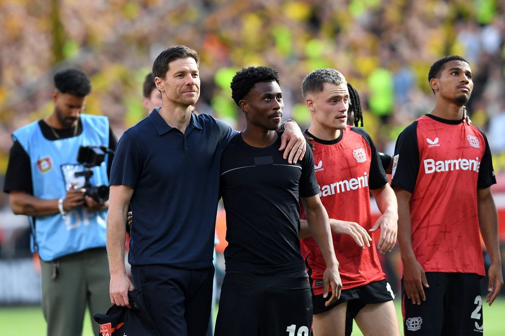 Coach Xabi Alonso and Nathan Tella Bayer 04 Leverkusen look on during the Bundesliga match between Bayer 04 Leverkusen and Borussia Dortmund, BayArena