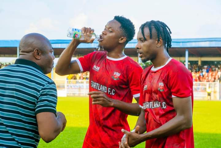 Coach Emmanuel Amunike with Heartland 